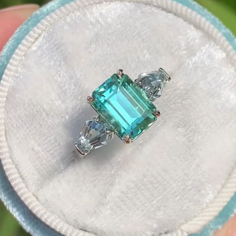 Mindy 11.19 Carat Emerald Cut Blue Three Stone Engagement Ring