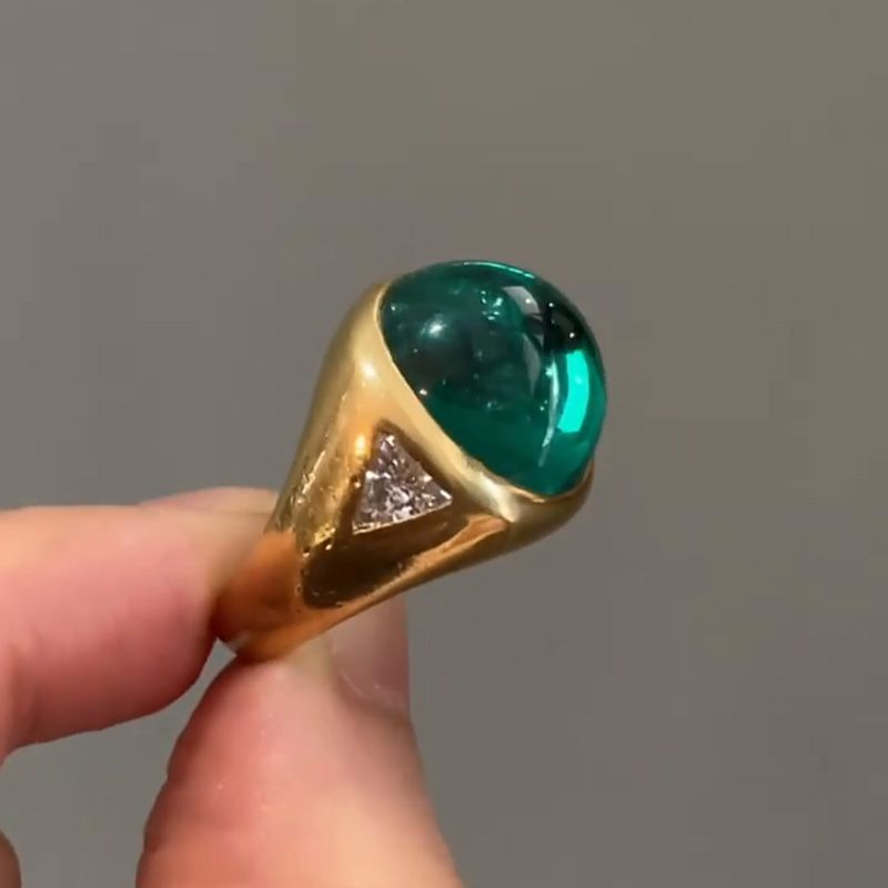 Zoya 9.5ct Cabochon Emerald With with Triangular Cut White Sapphire Shoulders Yellow Gold Ring